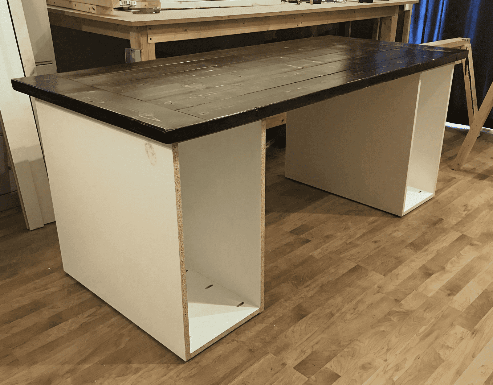 Desktop sitting on top of assembled cabinets